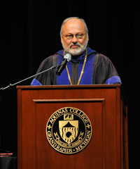 man by podium with microphone