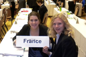 students holding a "France" sign