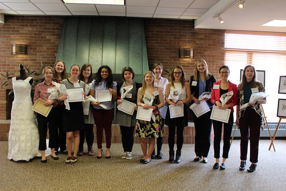 group of students holding awards