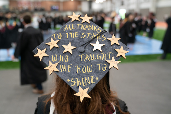 Decorated graduation cap reading "All Thanks to the Stars Who taught me how to Shine"