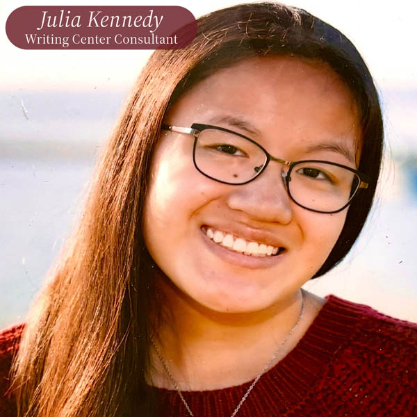 Headshot of a girl with long dark hair and glasses in a red sweater. Text reading: Julia Kennedy, Writing Center Consultant.