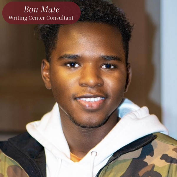 Headshot of a boy with short, dark hair and facial hair. Text reading: Bon Mate, Writing Center Consultant.