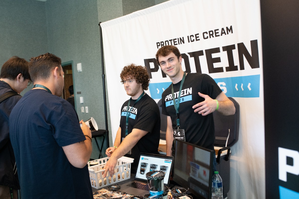 Paul Reiss and Mike Meadows at a table pitching their product