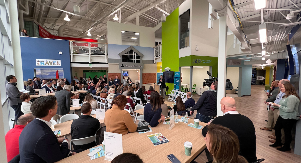 Crowd listens to speaker at JA Finance Park opening