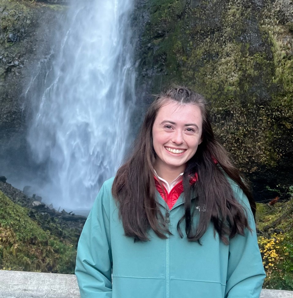 girl with waterfall in background